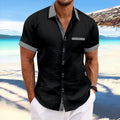 Man wearing a slim fit striped casual shirt in pure cotton, showing double button and short sleeve design.
