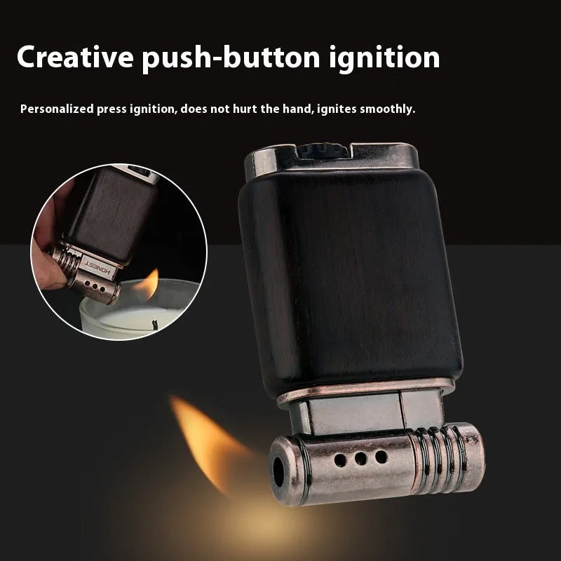 Ebony gas lighter with carved rosewood good luck design on a metal body.