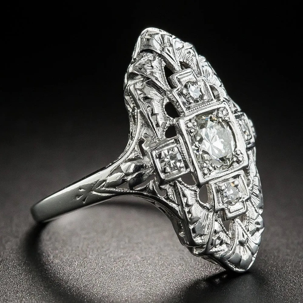 Geometric pattern hollow-out silver plated ring with diamond studs on a copper base.