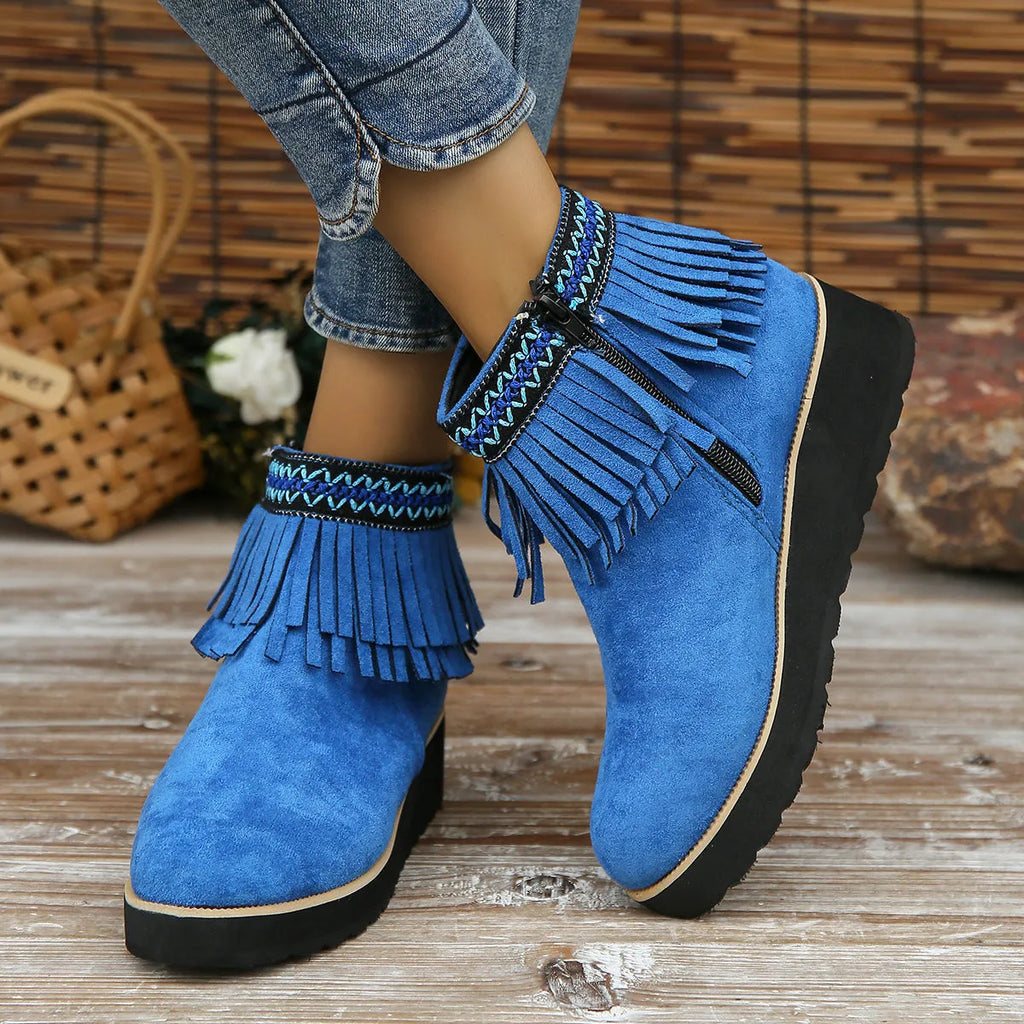 Women's dark brown suede wedge ankle boot with side zip, tassel, and thick rubber sole.