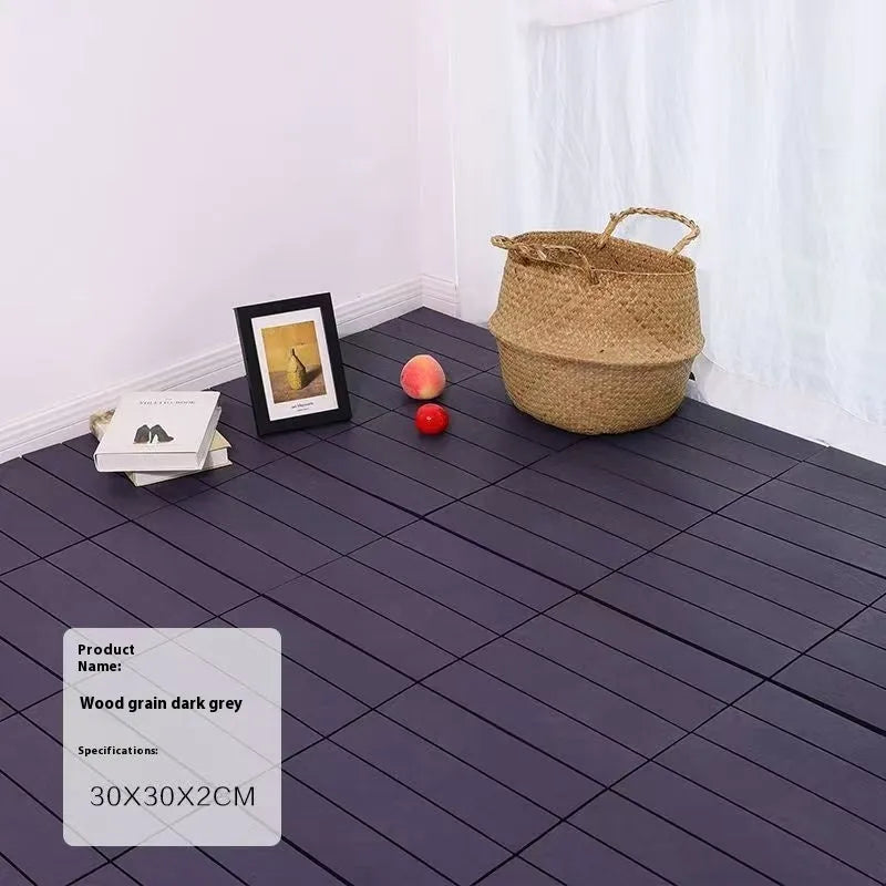 Wood grain plastic floor tiles in brown, grey and orange colours showing non-slip texture