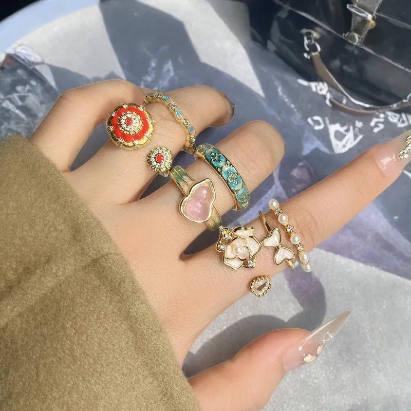 Adjustable vintage oil-dripping gourd copper ring with zircon inlay, showing flower shape in one of six colour options.