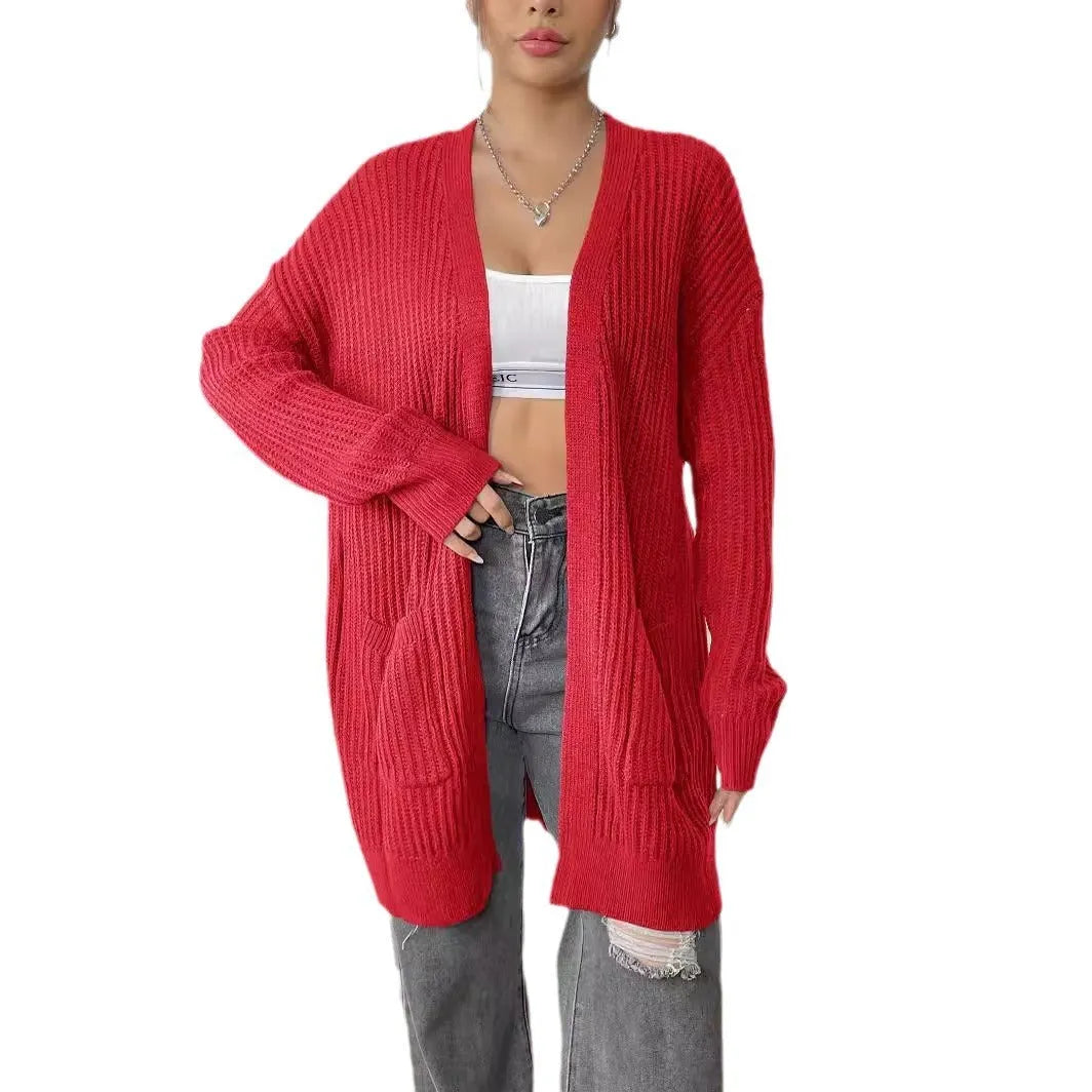 Women's dark green double pocket cardigan with long sleeves and loose fit.
