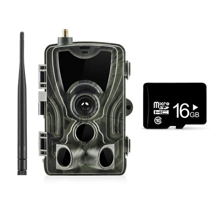 Outdoor camouflage surveillance camera with wide-angle lens on a green background.