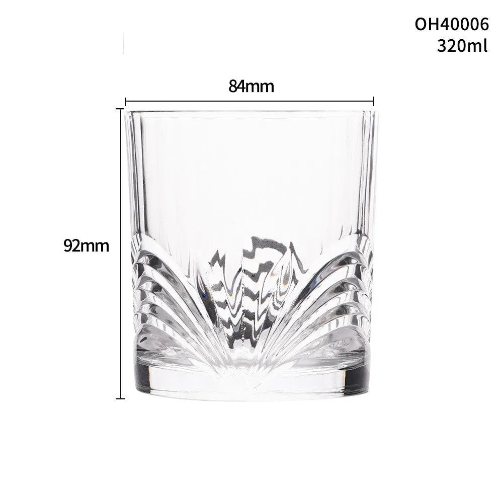 Clear thick-bottom whiskey shot glass with 301-400ml capacity on a table.