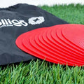 Yellow TPE football training target disc on grass, 23cm diameter flat landmark pad