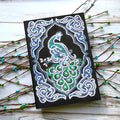 A5 black hardcover diamond painting notebook kit with peacock design, shaped drills, and bright drills.