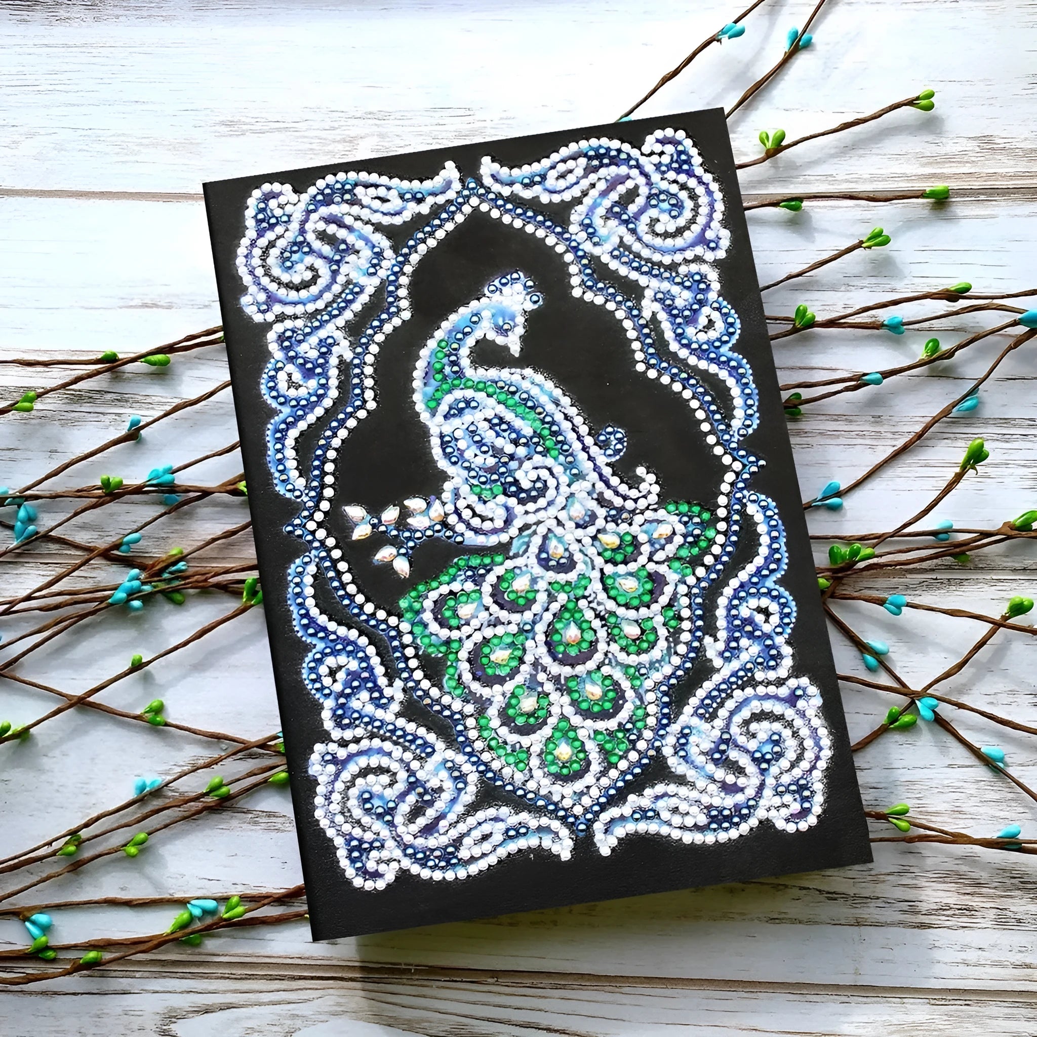 A5 black hardcover diamond painting notebook kit with peacock design, shaped drills, and bright drills.