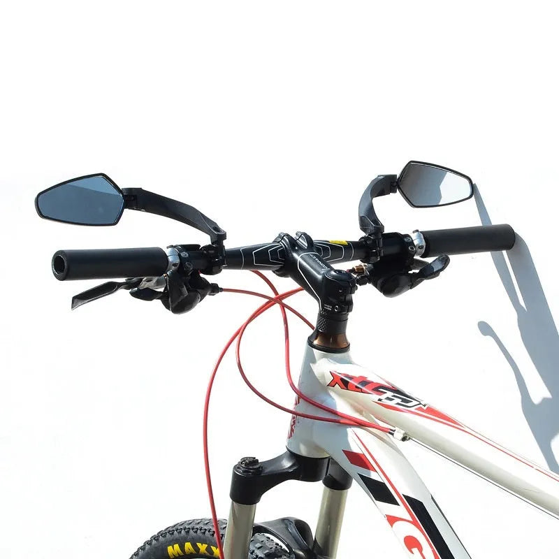 Black rotatable acrylic rearview mirror for mountain bike handlebars.