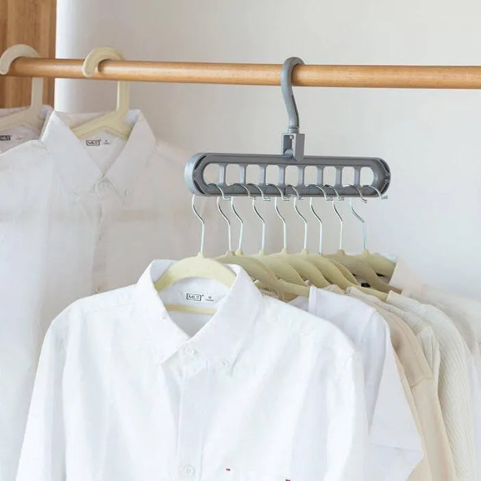 Plastic clothes hanger with rotating hook in assorted colours on white background