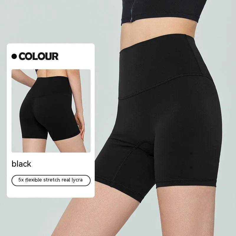 Women's high-waisted Lycra yoga shorts in leaf green, showing anti-exposure construction and short length.