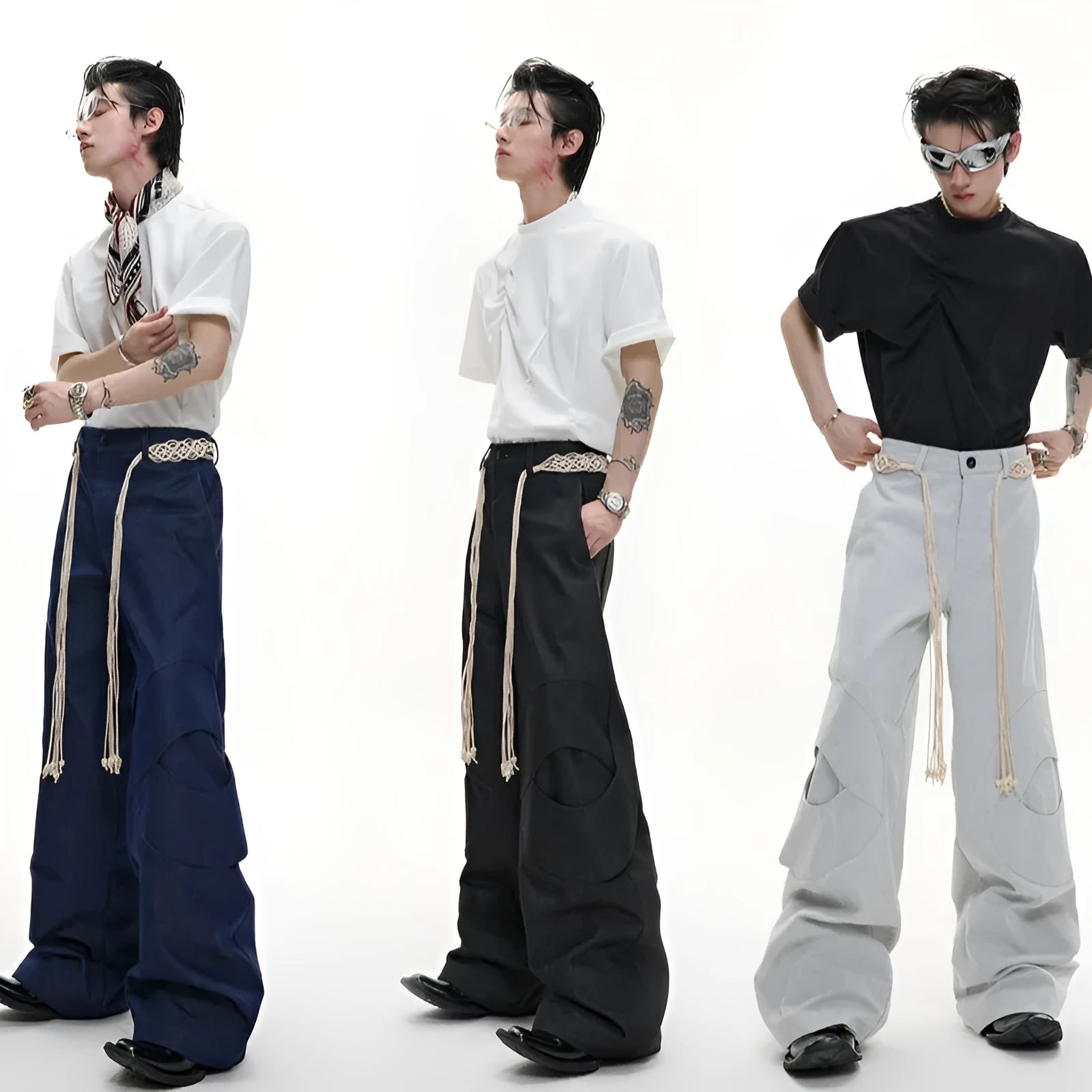 Men's dark blue straight-leg trousers showing heavy 3D cutting, belt stitching, and a front placket zipper.