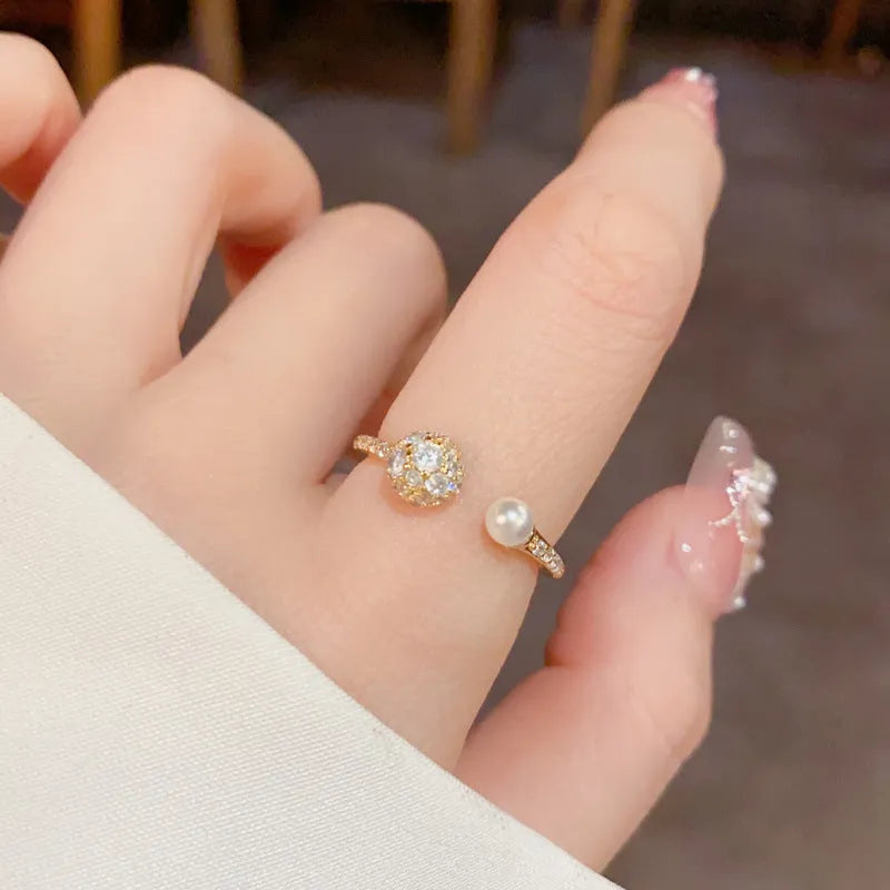Women's open-end ring with round zircon stones and gold plating on geometric copper band