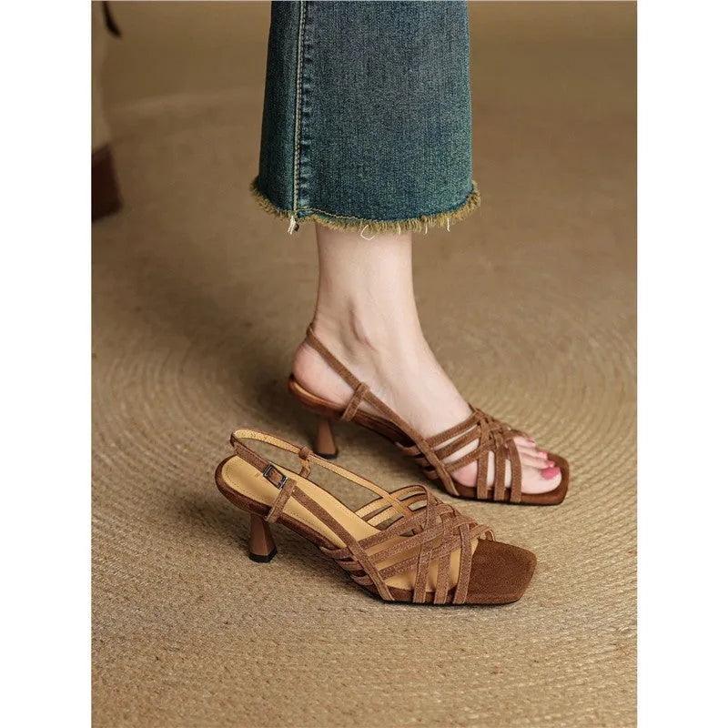 Women's light brown retro sandals with crossed straps, square toe, mid-heel, and ankle buckle on a white background.
