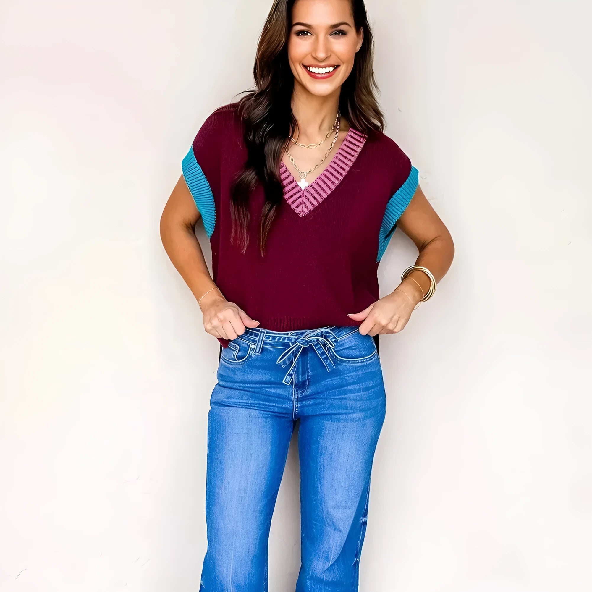 Burgundy loose-fitting V-neck sweater with contrast trim and cuffed short sleeves