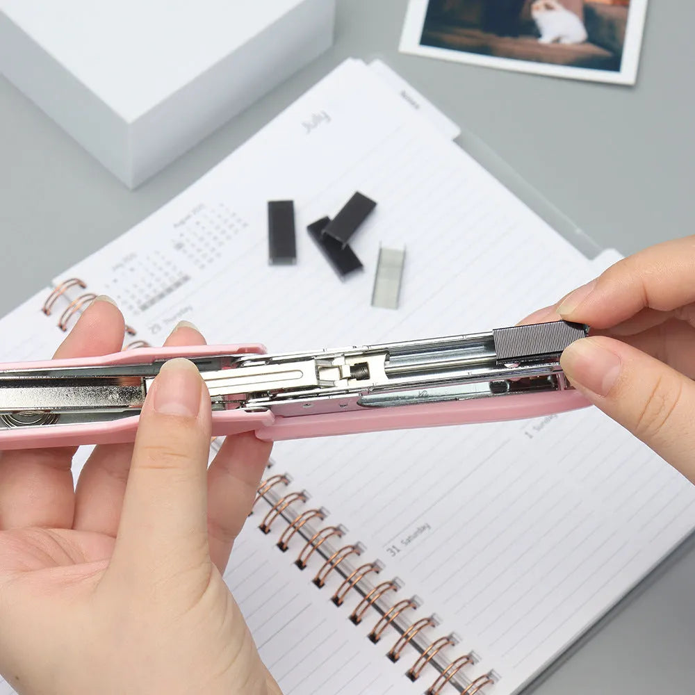 A box of 1000 metal office staples in choices of black, purple, rose gold, or rose red colour.