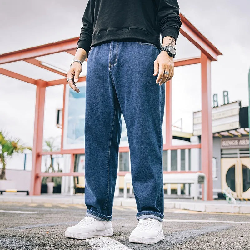 Men's loose straight jeans in dark blue colour showing mid waist and straight leg design