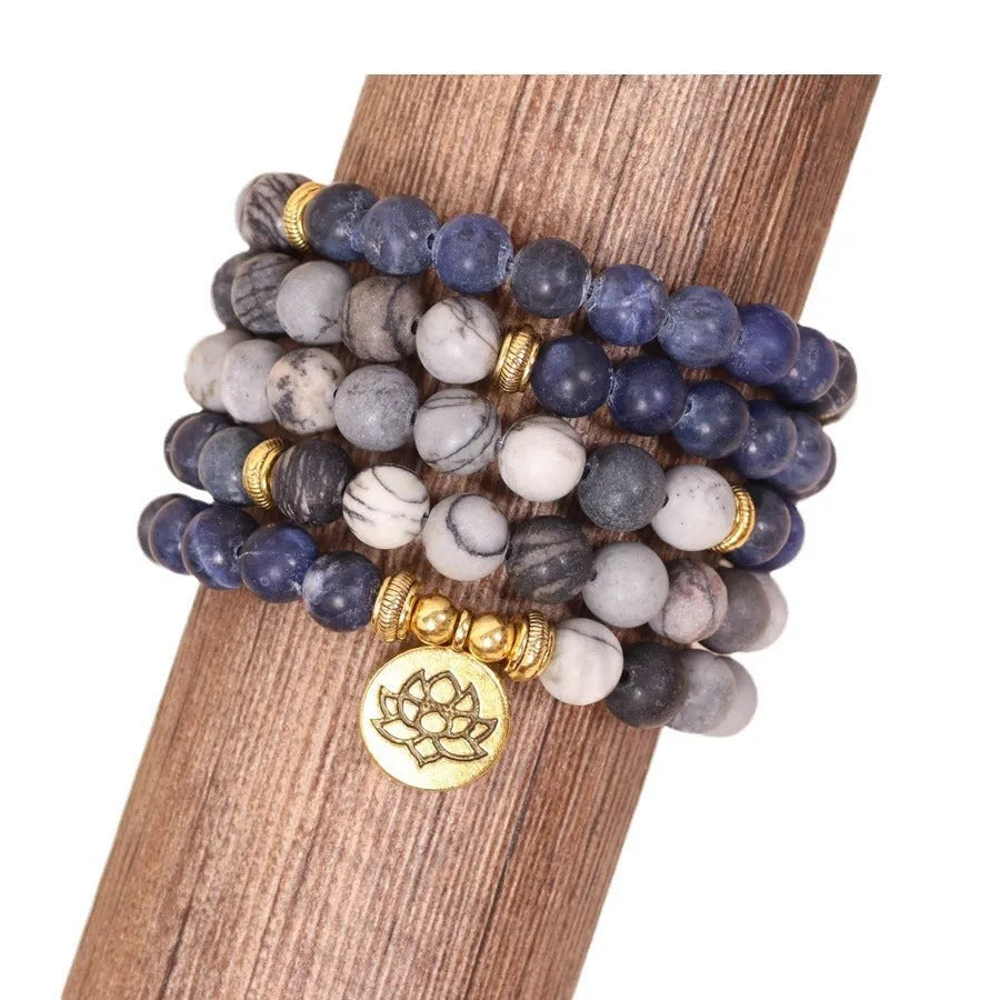 Layered multi-strand bracelet with blue patterned network stone beads and alloy toggle clasp