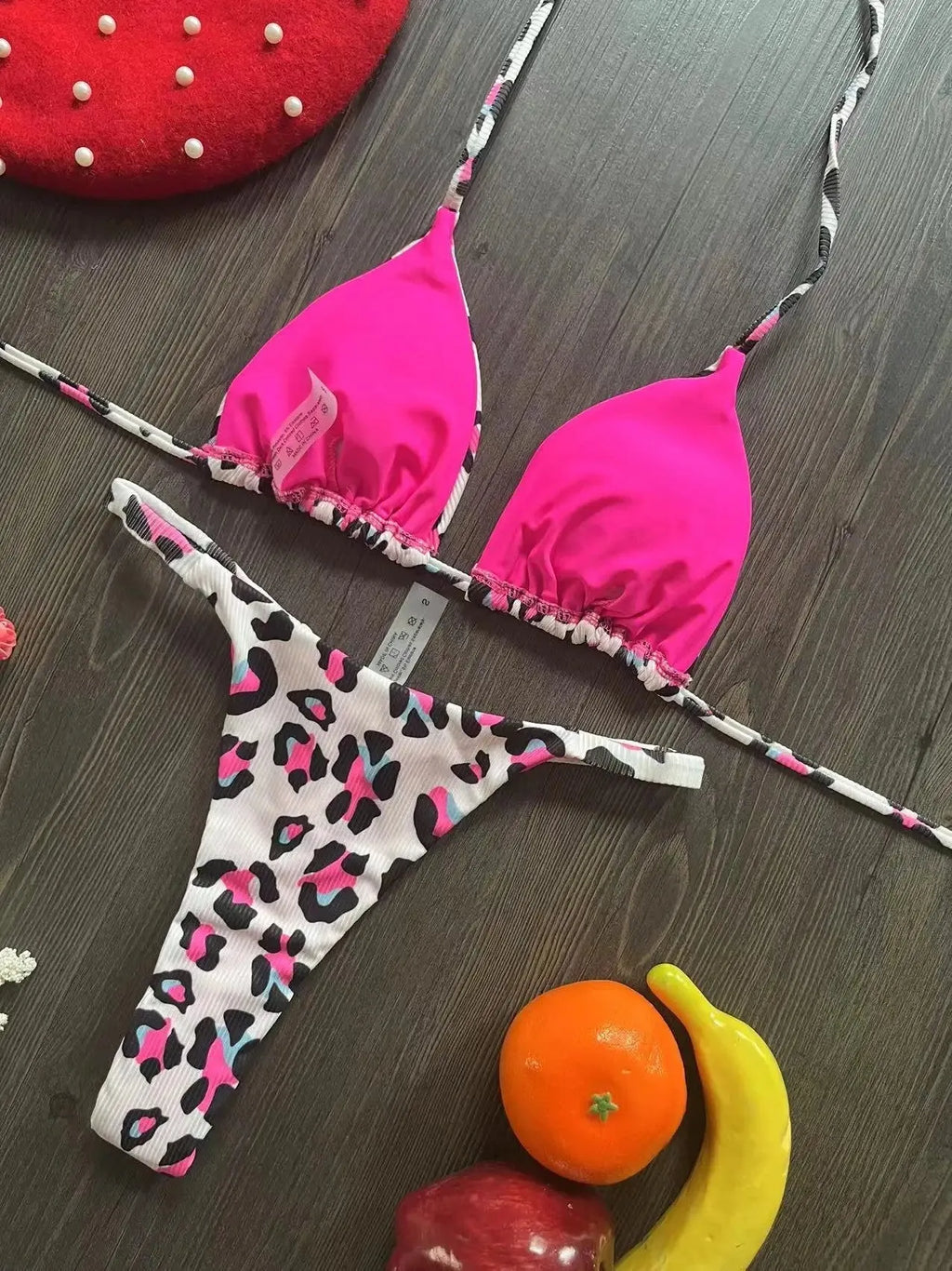 Women's bikini swimsuit with printed fabric in briefs style, showing high elasticity and cotton lining
