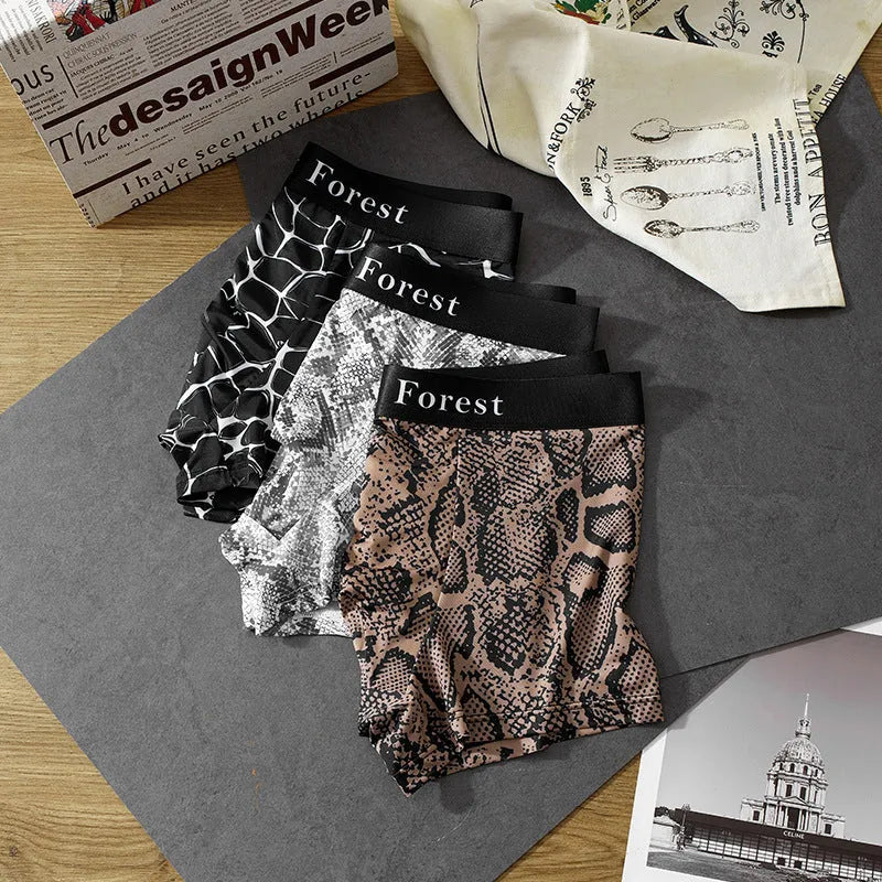 Men's loose-fit boxer shorts in black, grey, and brown colours made from thin polyester fabric.