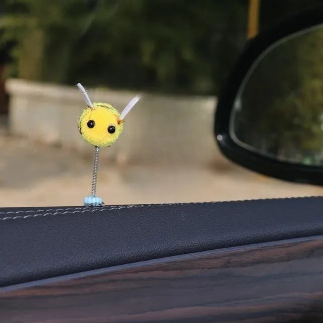 Swing spring bee car decoration with fur ball construction and cartoon design measuring 3x3cm