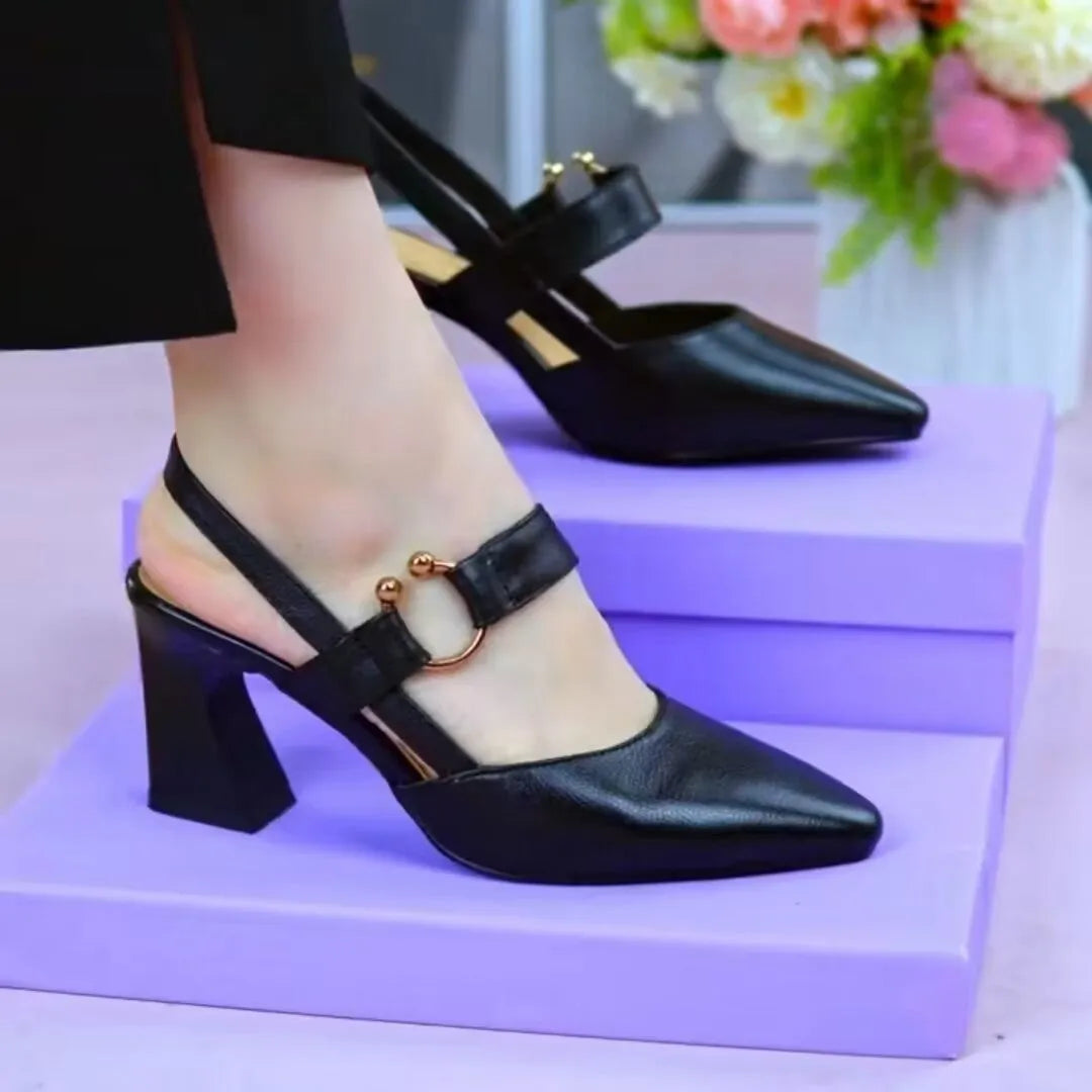 Women's apricot-coloured leather sandals with a closed toe, backless design, chunky heel, and an oversleeve strap.