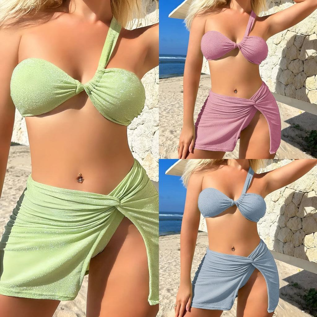 Light green one-shoulder tube top three-piece swimsuit set with matching skirt.