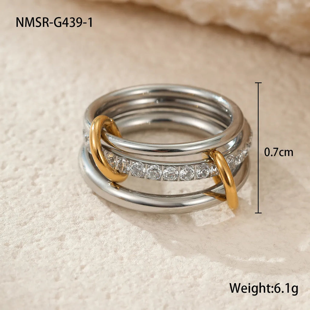 Stacked colour matching stainless steel ring set with 18K gold plating and exaggerated profile