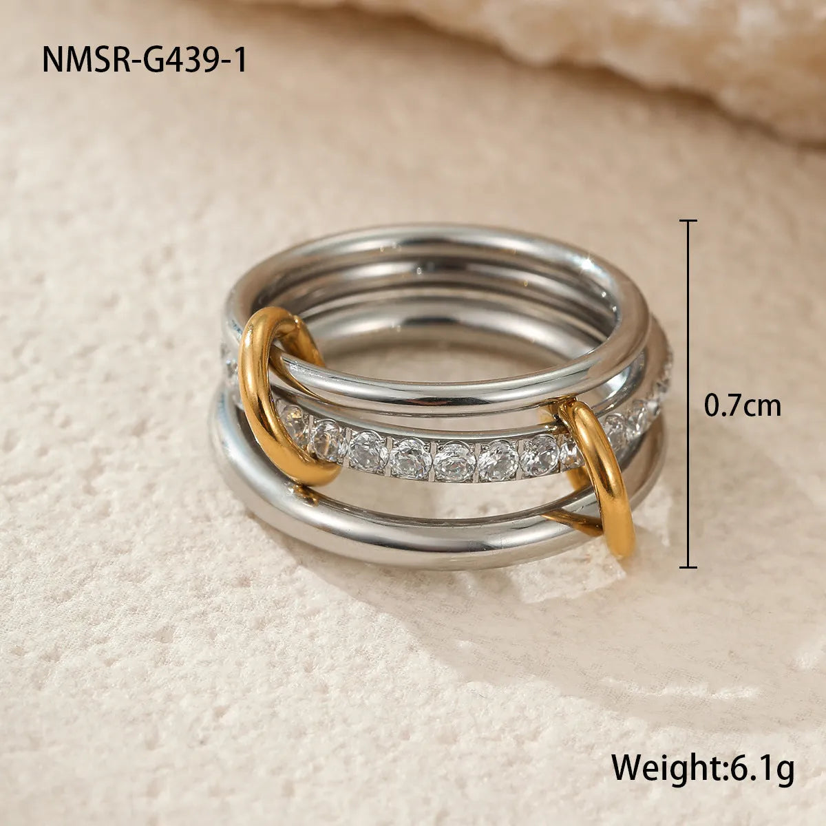 Stacked colour matching stainless steel ring set with 18K gold plating and exaggerated profile