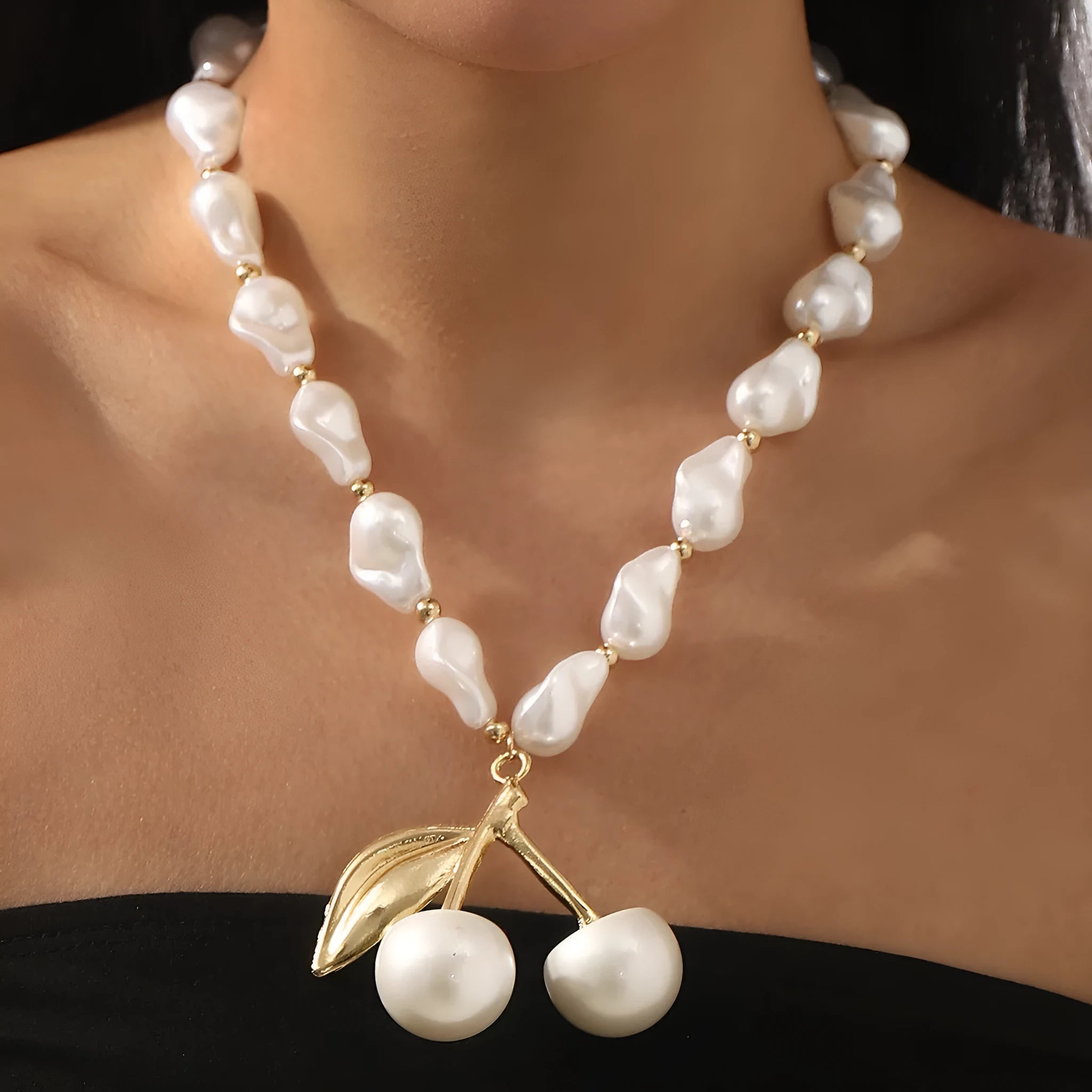 Geometric fruit pendant necklace with pearl chain in gold finish, measuring 51-60cm circumference