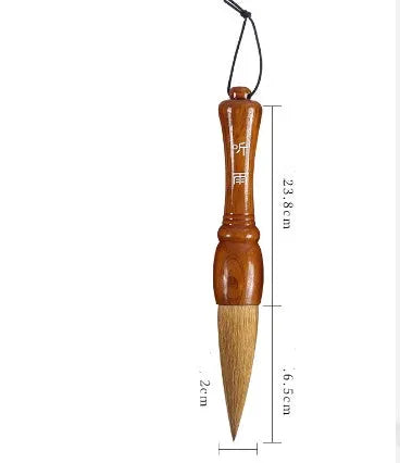 Large traditional Chinese wrist calligraphy brush with sheep hair nib on paper.