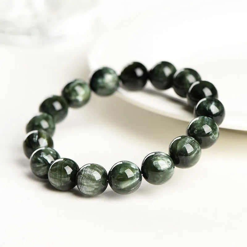 Green dragon crystal bracelet with 8-9mm round beads featuring geometric and Ruyi designs