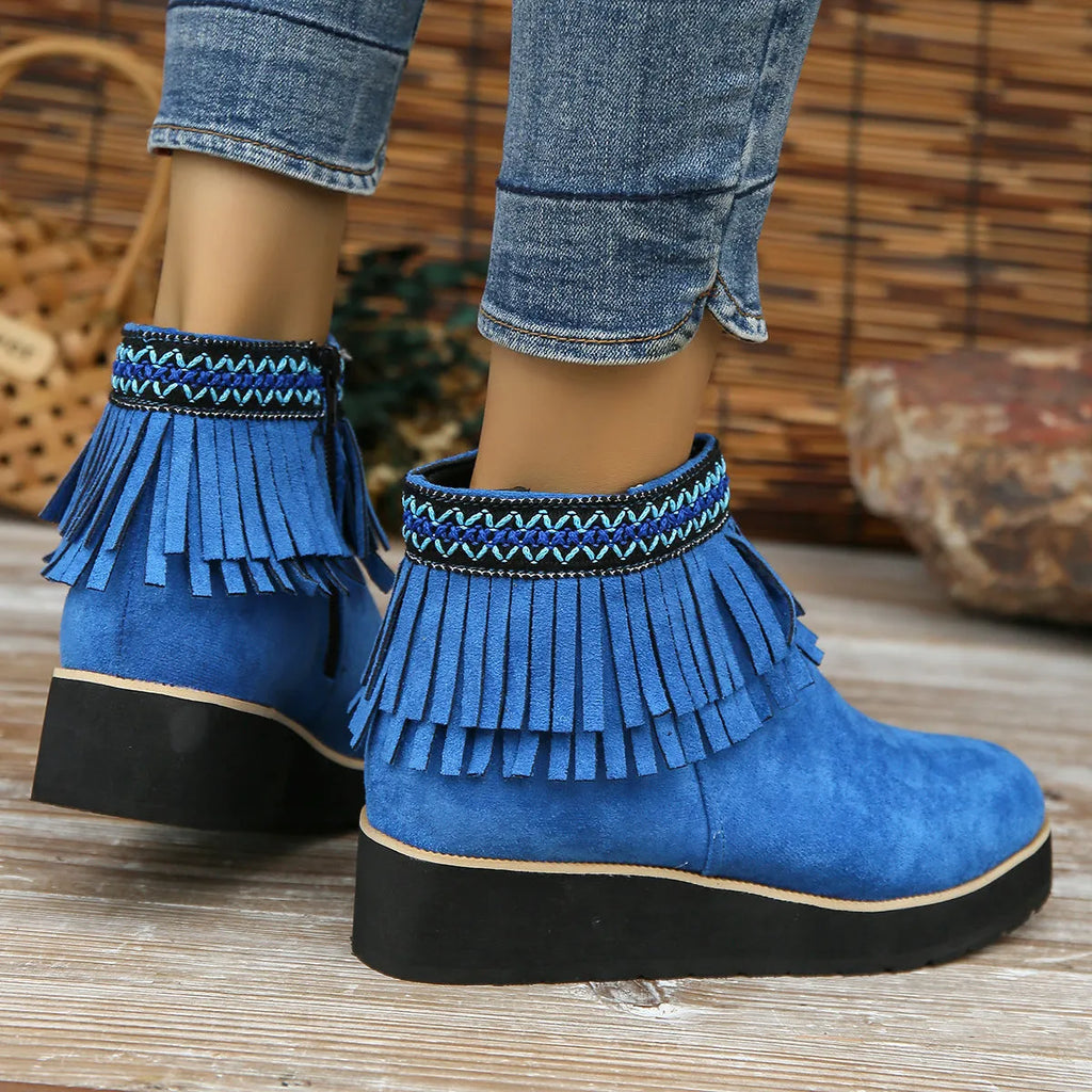 Women's dark brown suede wedge ankle boot with side zip, tassel, and thick rubber sole.