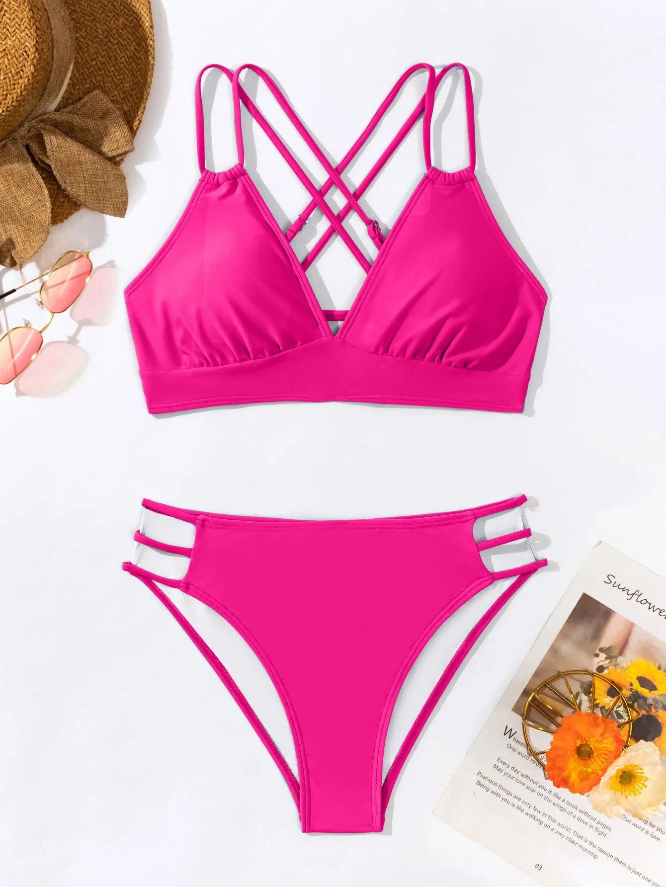 Women's black V-neck halter bikini with removable padded bra and split shorts.