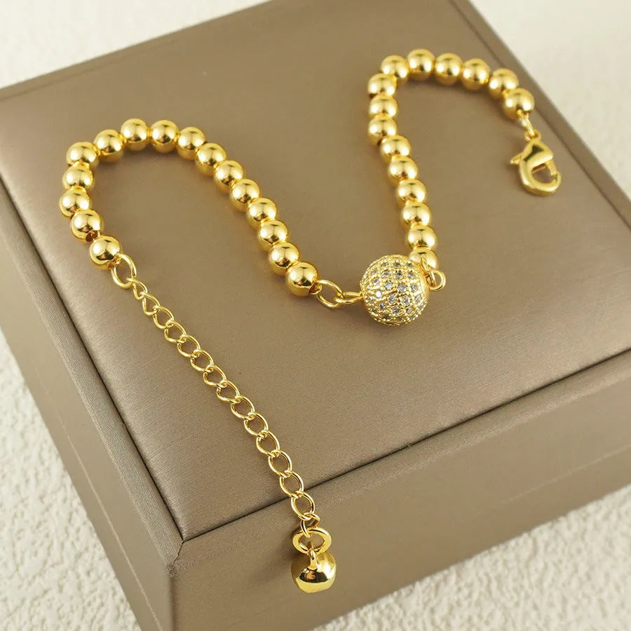Copper bracelet with heart shape design, zircon accents and Arabic style patterning
