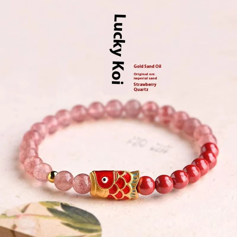 Close-up of a women's purple cinnabar and strawberry quartz lucky bead bracelet in a retro style.