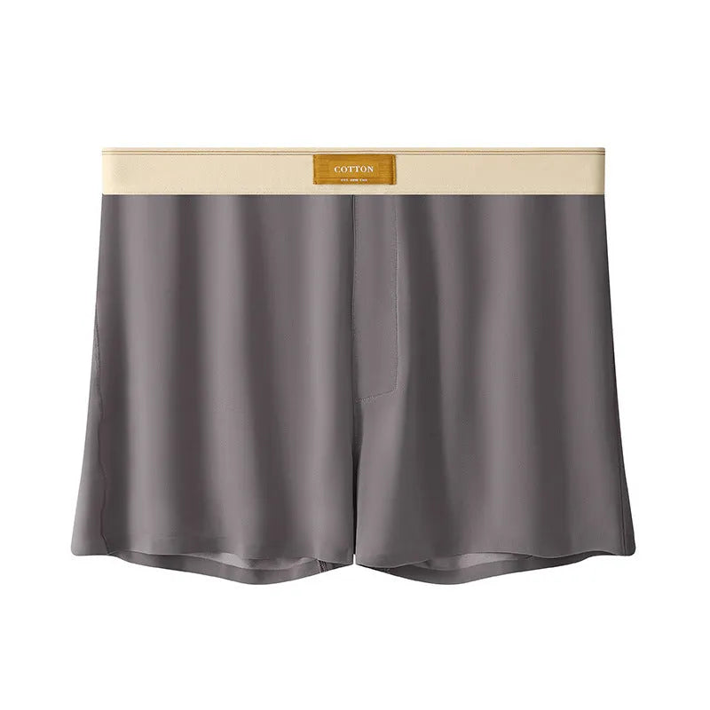 Pack of three pairs of men's solid colour ice silk underwear on a white background.
