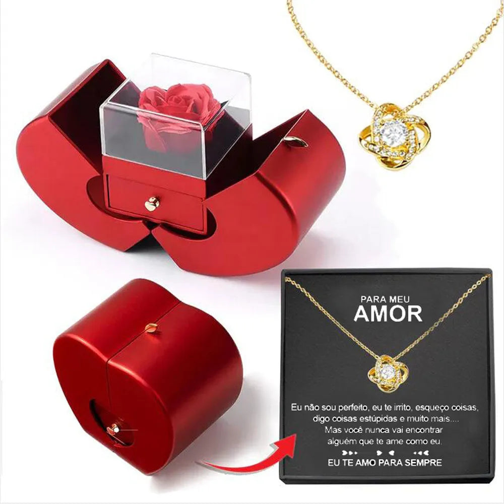 Red apple-shaped jewelry box with eternal soap flower rose and silver necklace inside