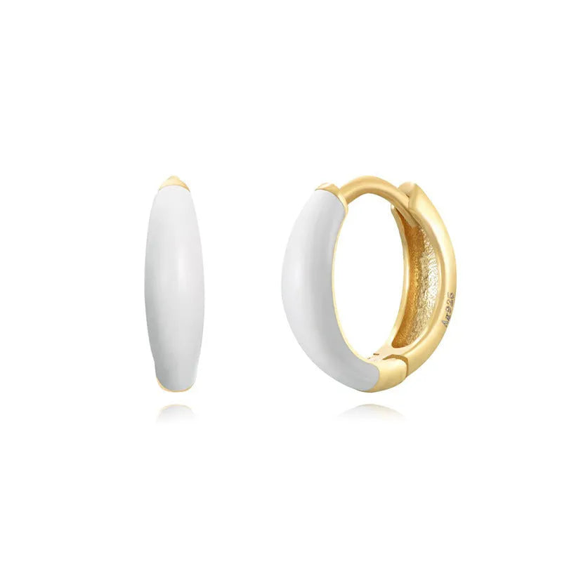 Geometric epoxy resin earrings with dripping oil colour technique showing oval curves and integrated rings