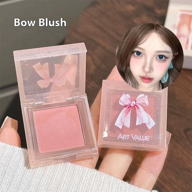 Butterfly Box makeup set with four lip muds, powder blusher and necklace in pink packaging