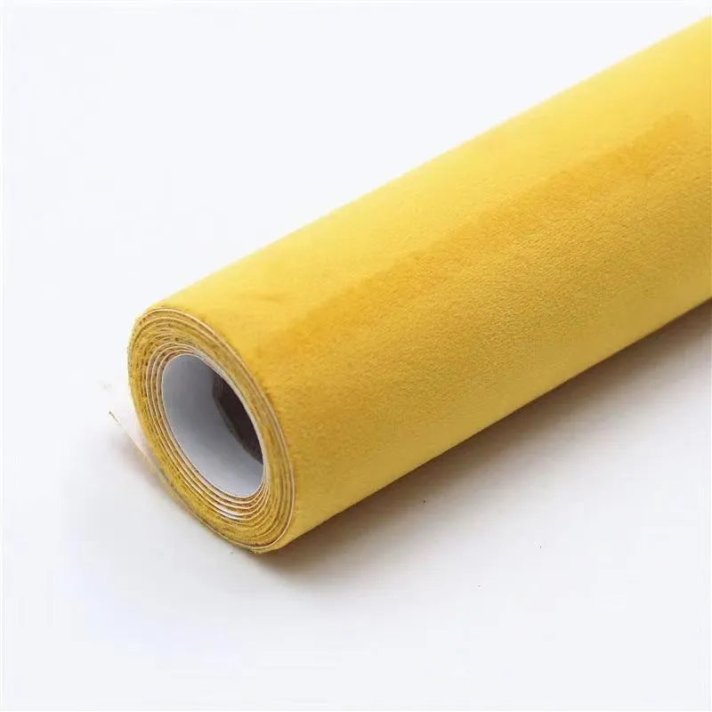 Self-adhesive leather suede sheet roll in multiple colour swatches showing black, brown, blue, and red.