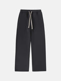 Men's black fleece-lined sweatpants with elastic waistband and drawstring closure in loose fit
