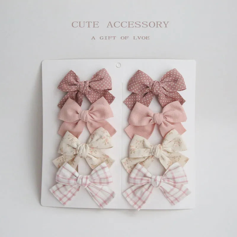Children's eight-piece cloth bow hairclip set in dovetail shape with multiple colour options