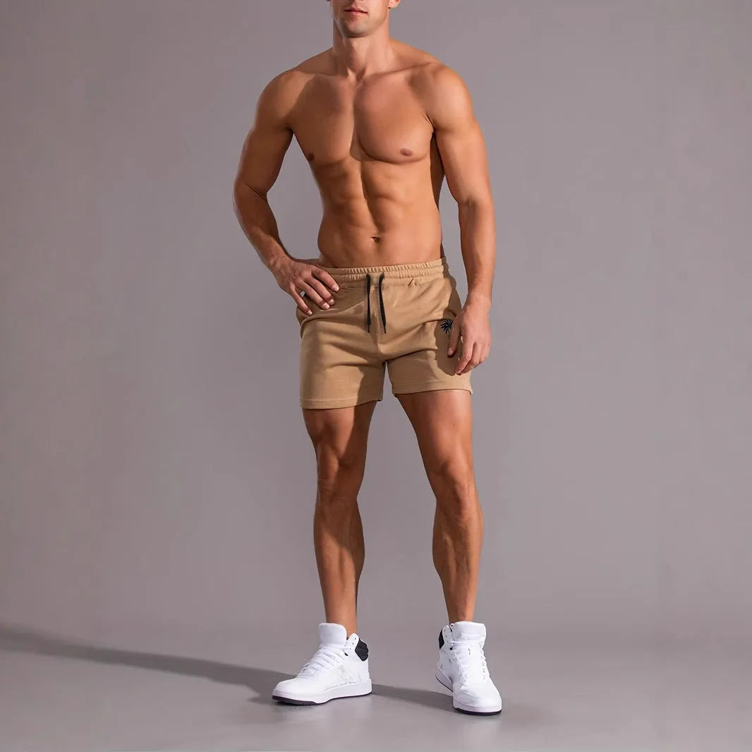 Men's khaki coconut print sports shorts with straight cut design and micro-elastic polyester fabric