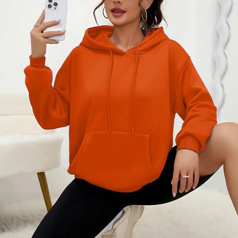 Women's loose fit grey drawstring hood sweatshirt with front pockets, long sleeves