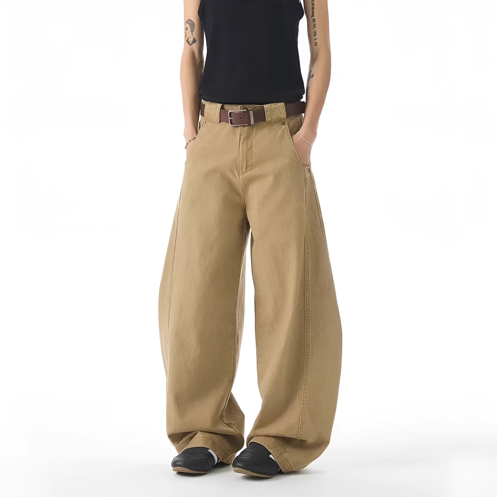 Men's brown loose-fit straight leg denim jeans on a plain background
