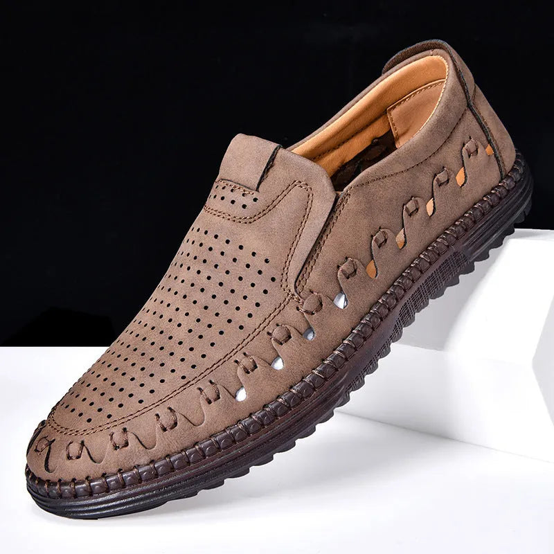 Men's brown slip-on casual shoes with round toe, flat heel, and visible sewing line details.