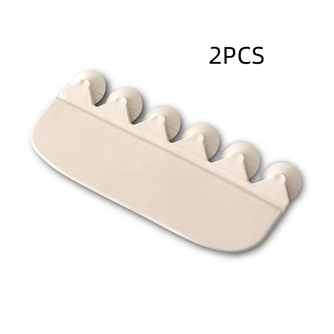 White PVC children's toilet training splash guard placed on a toilet seat.