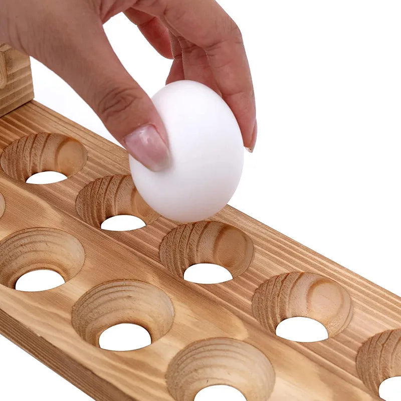 Solid wood egg storage rack in fire colour on a kitchen countertop