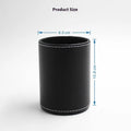Round black leather pen holder with 8.0cm diameter on a desk
